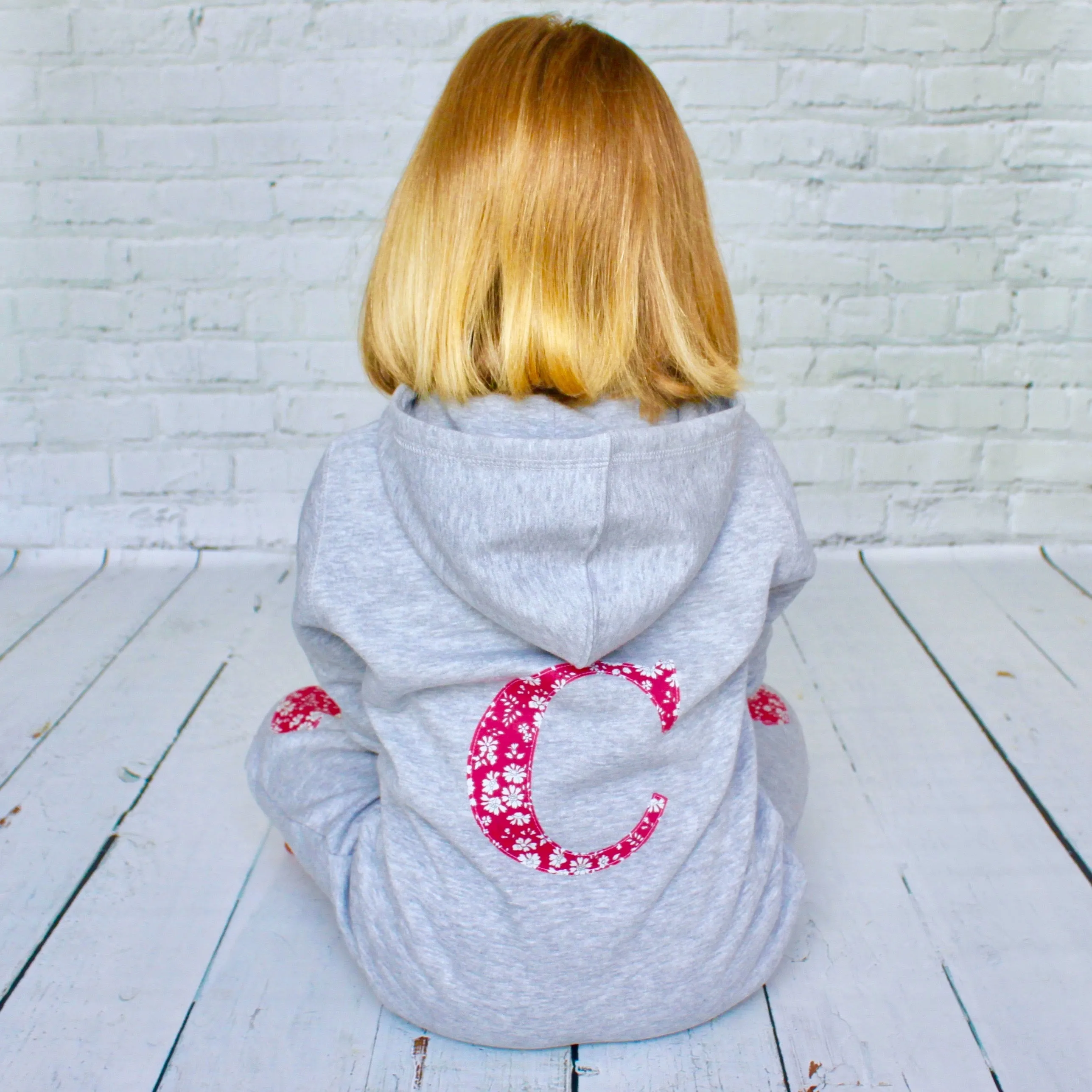 Initial onesie with knee patches