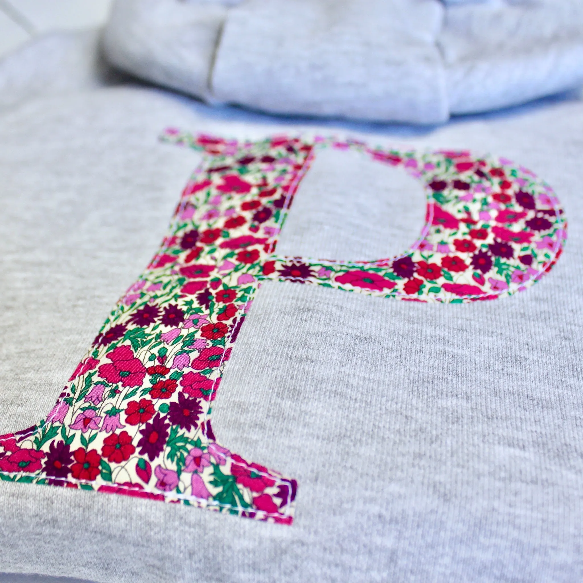 Initial onesie with knee patches