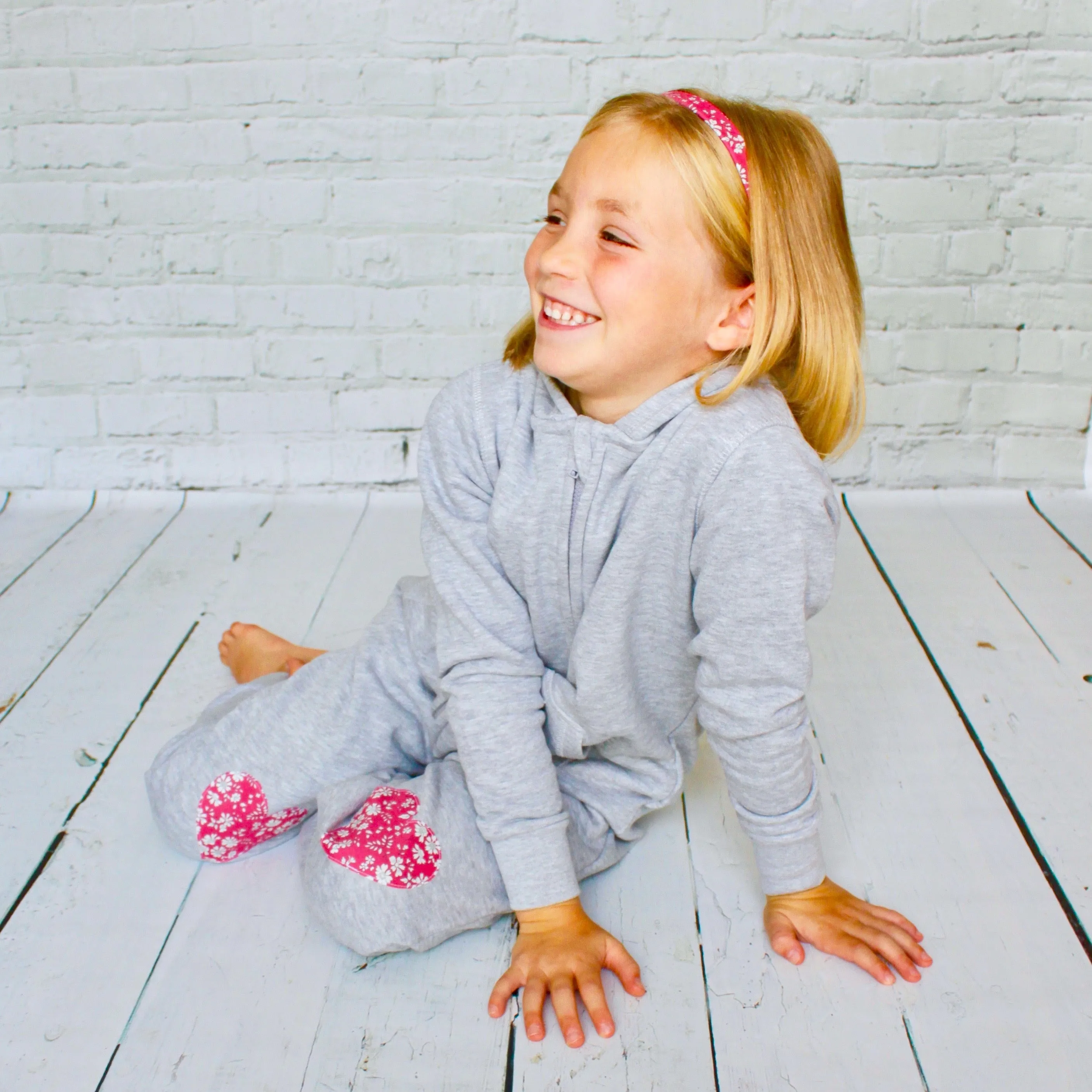 Initial onesie with knee patches