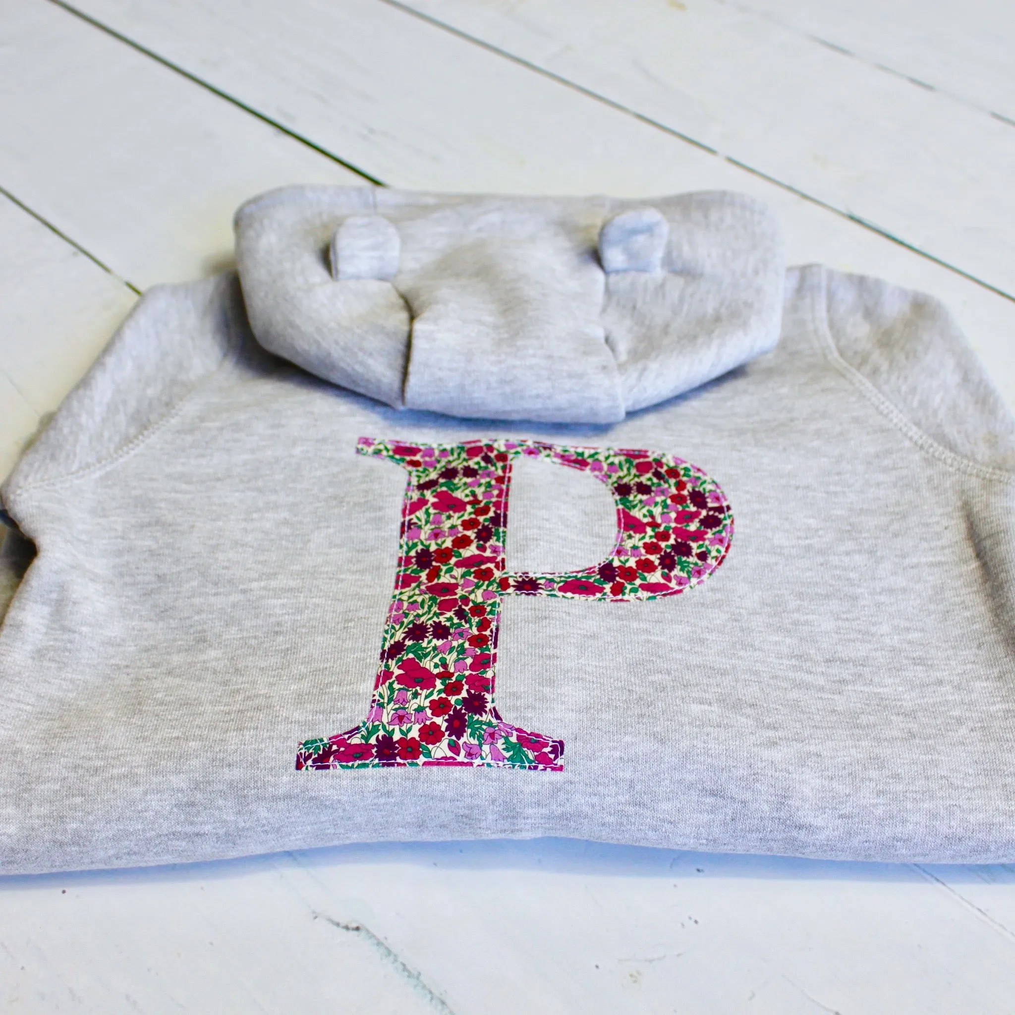 Initial onesie with knee patches